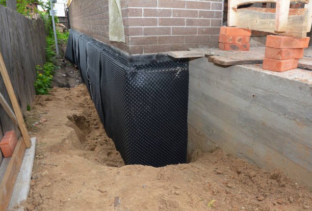 Happy homeowners after waterproofing job in Arcanum